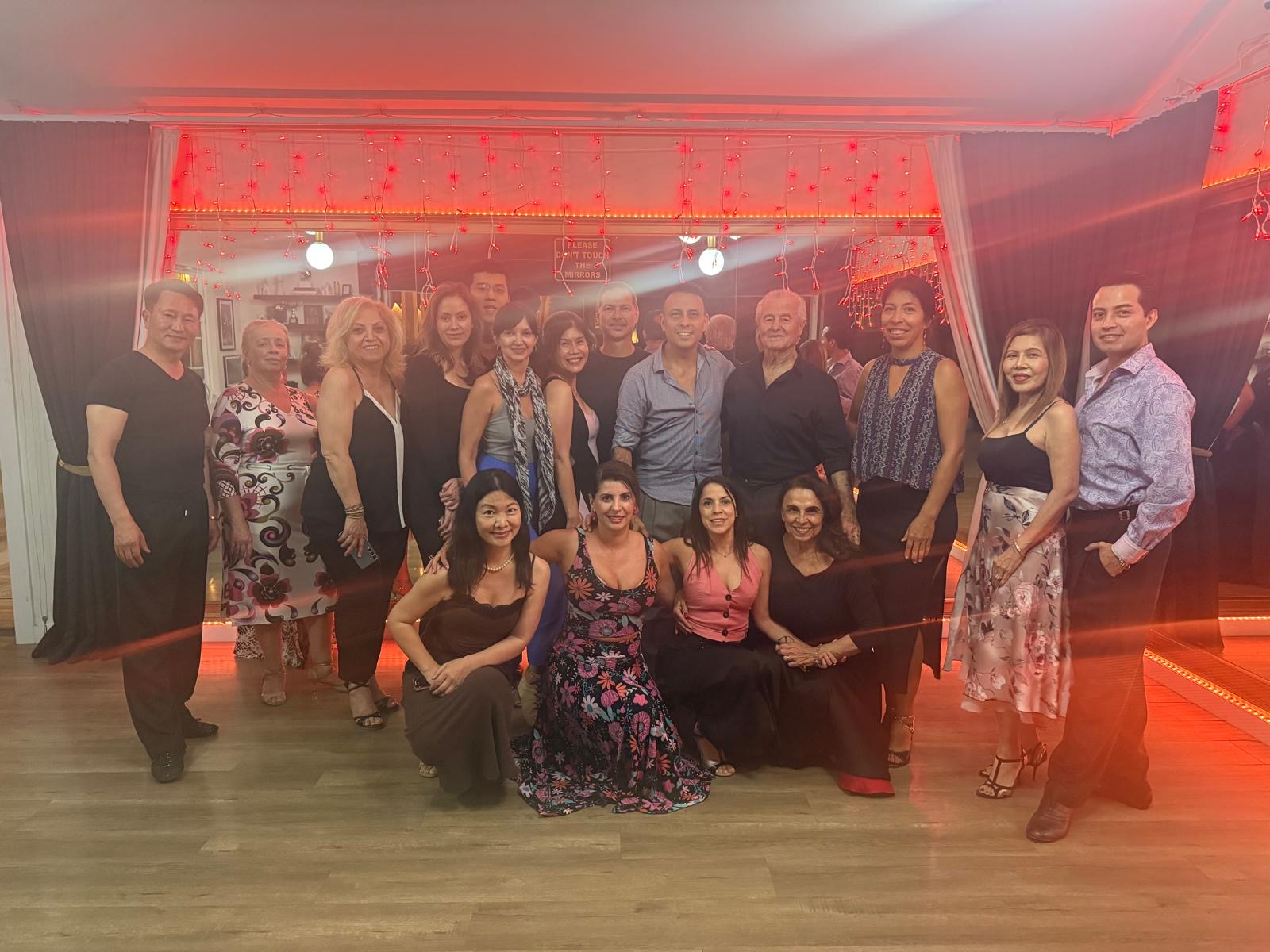 Group photo with students, red ambient lighting